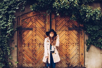 Woman Standing in Front of Wooden Door