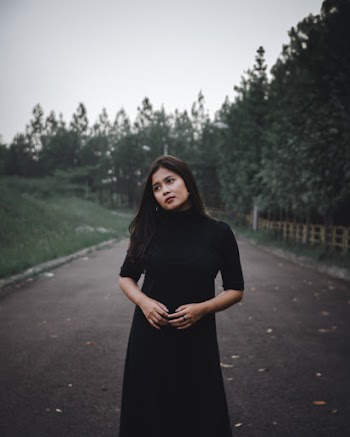 Woman Standing in Middle of Road