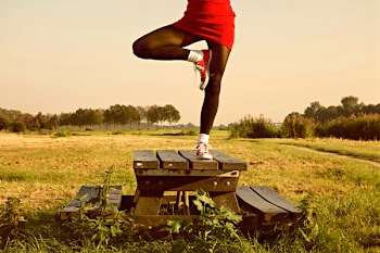 Woman Standing in One Foot on Table
