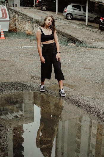Woman Standing in Parking Lot