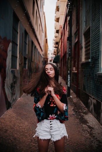Woman Standing in the Middle of Houses