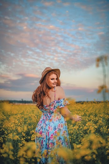 Woman Standing in Yellow Flower Field