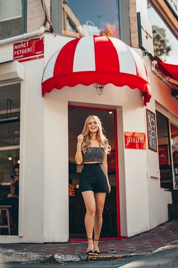 Woman Standing Infront Of A Bar Restaurant