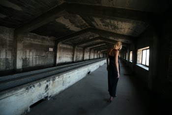 Woman Standing Inside Attic