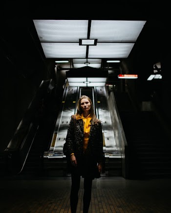 Woman Standing Inside Dark Room