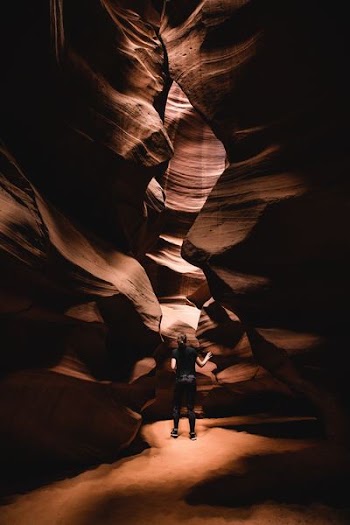 woman standing inside landmark