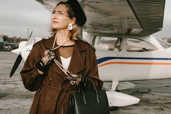 Woman Standing Near Airplane