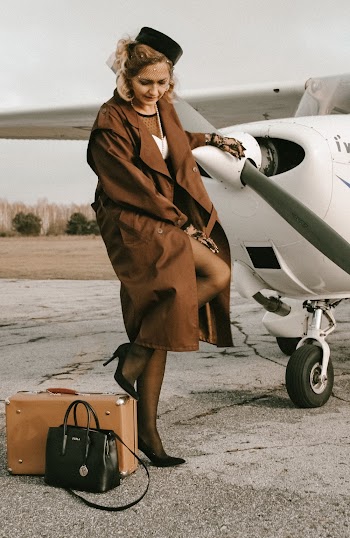 Woman Standing Near Airplane