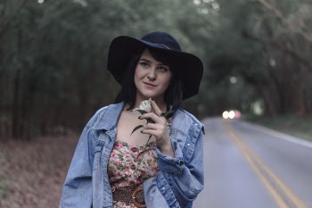 Woman Standing Near Asphalt Road