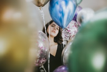 Woman Standing Near Balloons