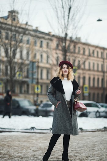 Woman Standing Near Bare Tree