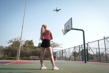 Woman Standing Near Basketball Hoop