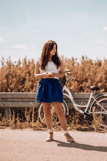 Woman Standing Near Bicycle