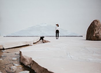 Woman Standing Near Big Rock