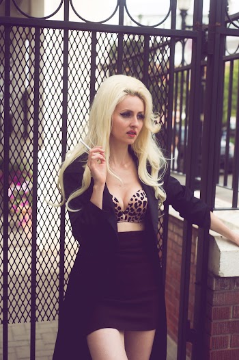 Woman Standing Near Black Metal Fence