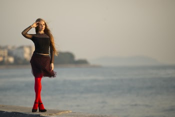Woman Standing Near Body of Water