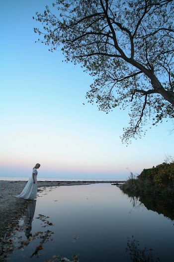 Woman Standing Near Body of Water