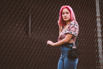 Woman Standing Near Brown Fence