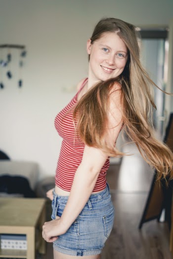 Woman Standing Near Brown Wooden Table