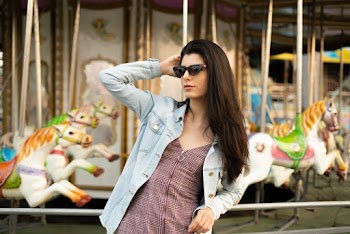 Woman Standing Near Carousel
