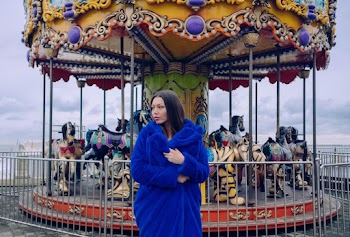Woman Standing Near Carousel