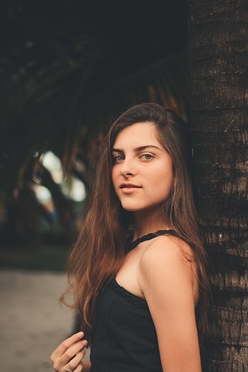 Woman Standing Near Coconut Tree
