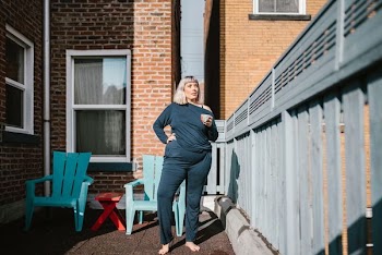 woman standing near concrete building