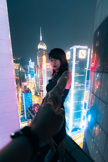 Woman Standing Near Edge Of Building 