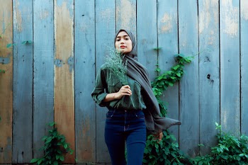 Woman Standing Near Fence