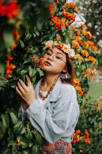 Woman Standing Near Flowers