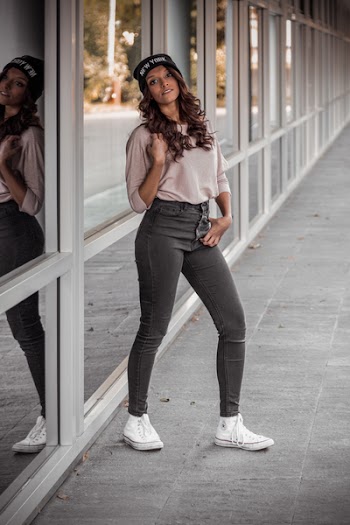 Woman Standing Near Glass Wall