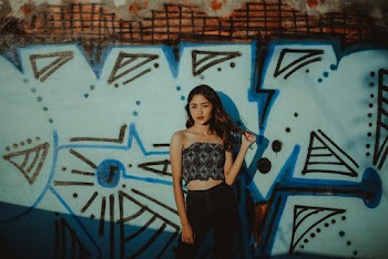 Woman Standing Near Graffiti 