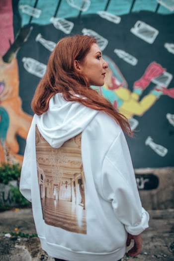 Woman Standing Near Graffiti Wall