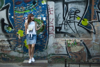 Woman Standing Near Gray and Blue Wall