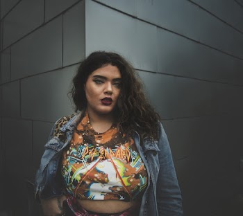 Woman Standing Near Gray Concrete Wall