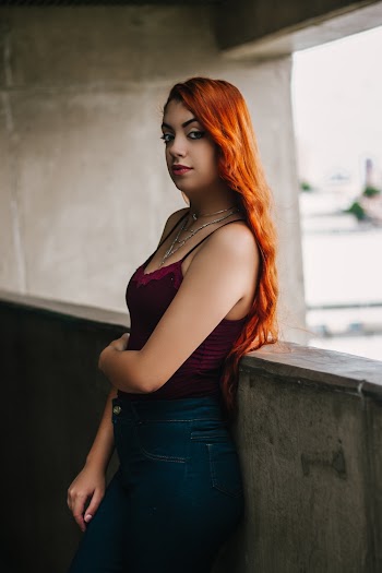 Woman Standing Near Gray Surface