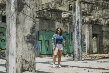 Woman Standing Near Gray Wall With Graffiti