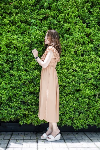 Woman Standing Near Green Plant