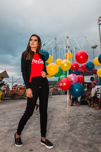 Woman Standing Near Hanging Balls