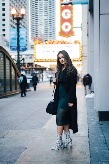 Woman Standing Near High Rise Building