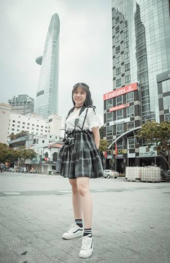 Woman Standing Near High-rise Buildings