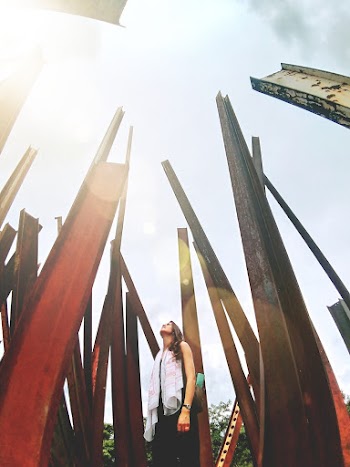Woman Standing Near Metal