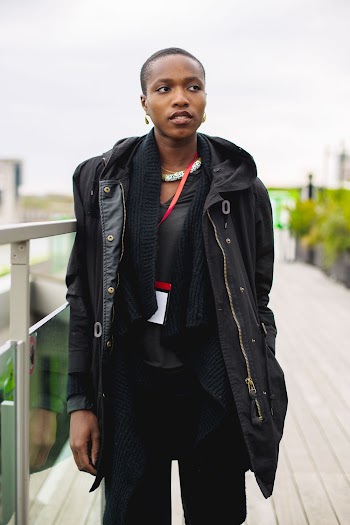 Woman Standing Near Metal Railings