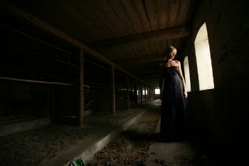 Woman Standing Near Open Window Inside Room