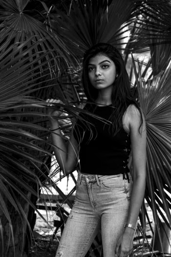 Woman Standing Near Palm Tree