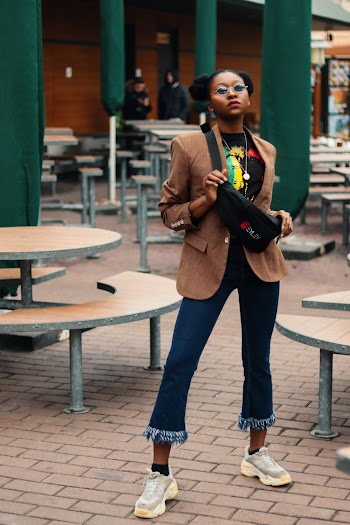 Woman Standing Near Picnic Tables