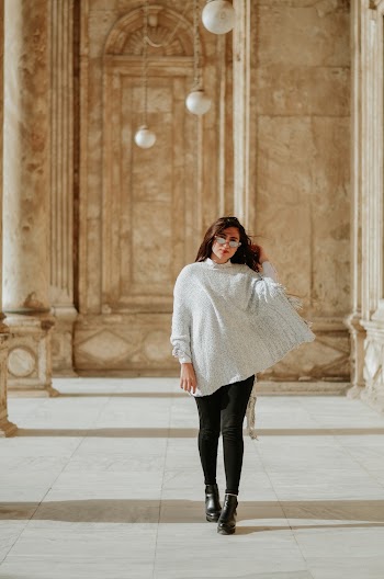 Woman Standing Near Pillars