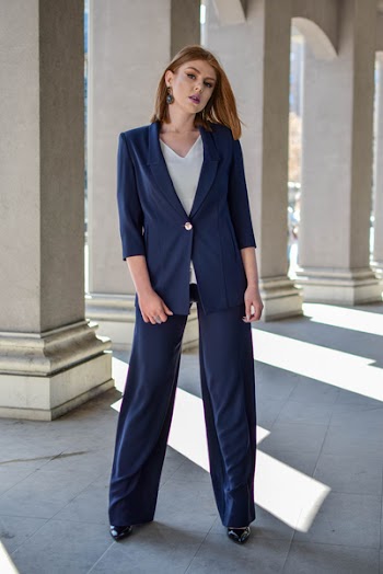 Woman Standing Near Pillars