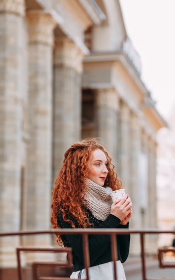 Woman Standing Near Pillars