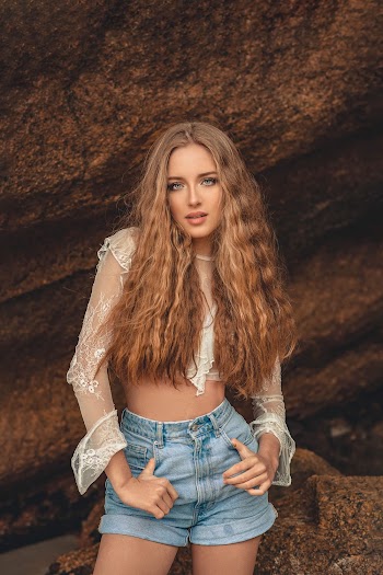Woman Standing Near Rock